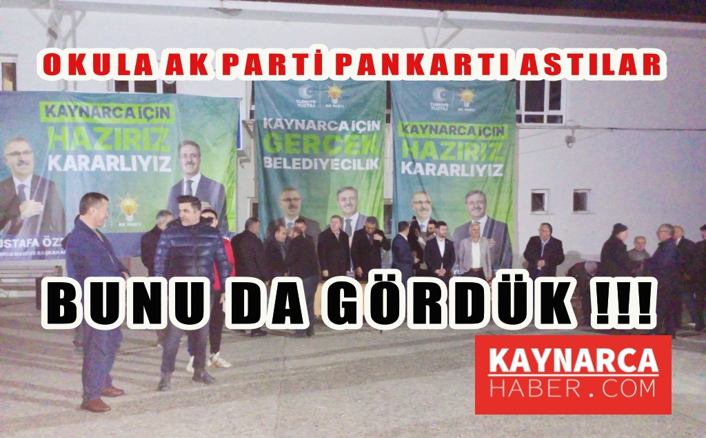 AK Parti Milletvekilleri okul binasına asılan parti afişlerinin altında konuştu